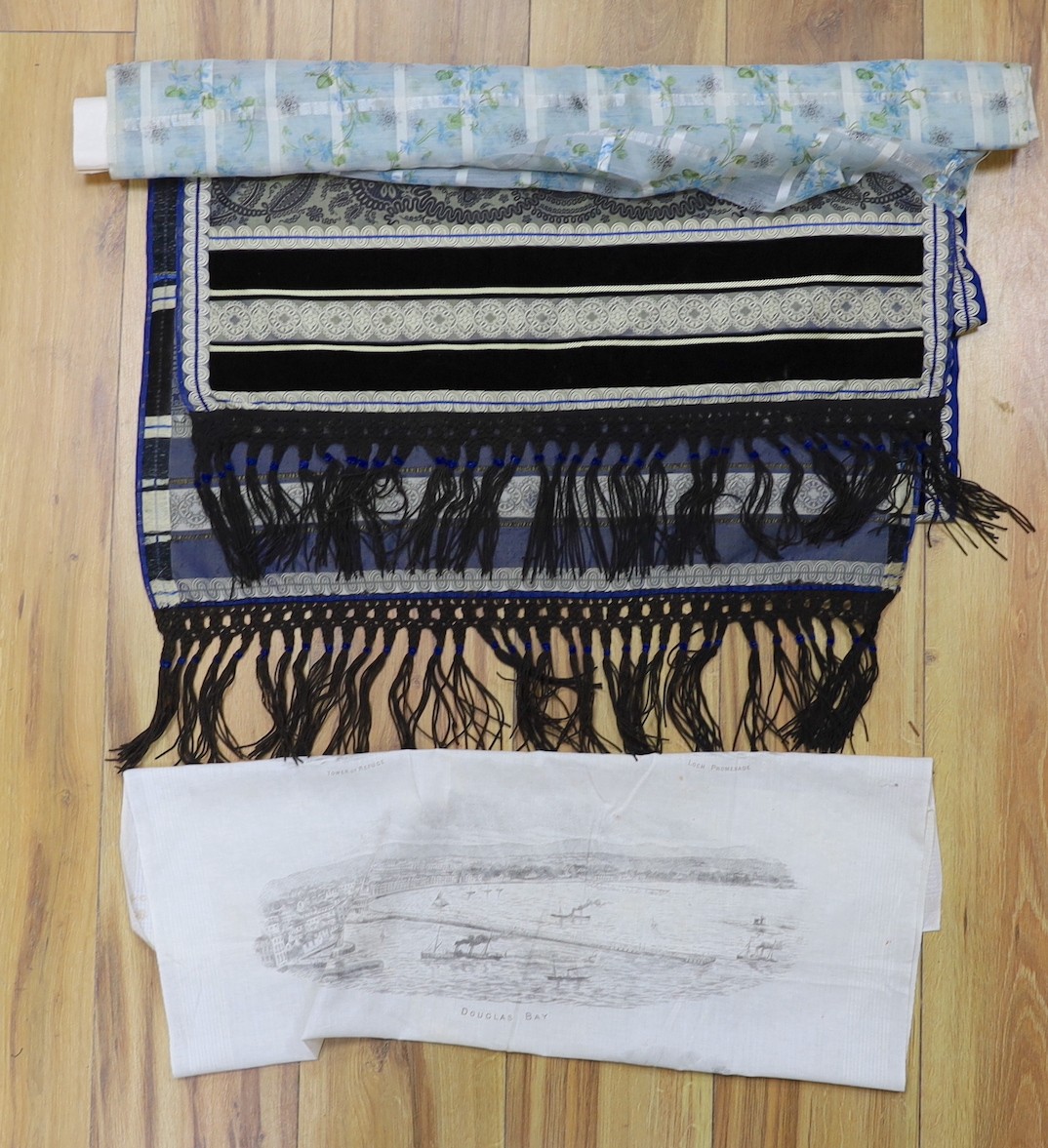 An early Victorian silk and velvet ladies stole, a length of finely woven silk with a woven check design and floral overprint, and a 19th century kerchief printed with scenes from the Isle of Man